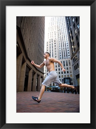 Framed Side profile of a young man running in a city Print