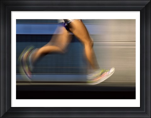 Framed Low section view of a person running on blue Print