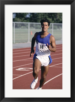 Framed Male athlete running on a running track Print