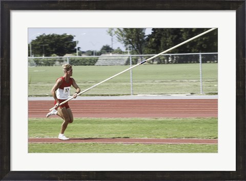 Framed Male athlete pole vaulting Print