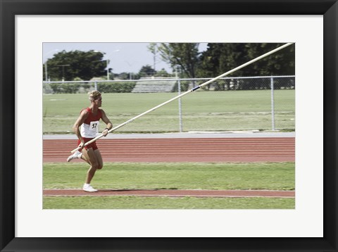 Framed Male athlete pole vaulting Print