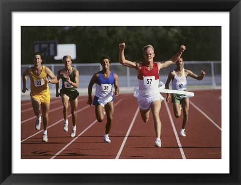 Framed Male athletes running on a running track Print