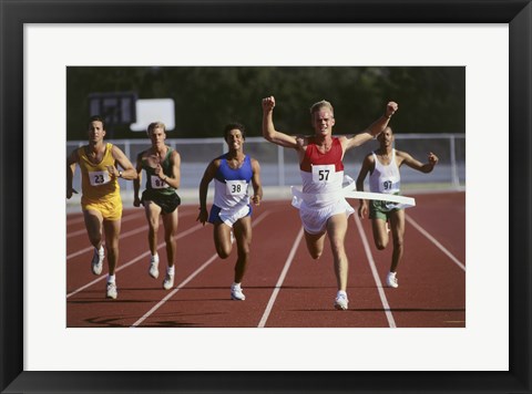 Framed Male athletes running on a running track Print