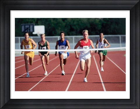 Framed Male athletes running on a running track Print
