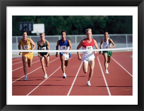 Framed Male athletes running on a running track Print