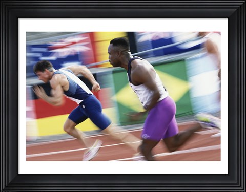 Framed Side profile of two young men running on a running track Print