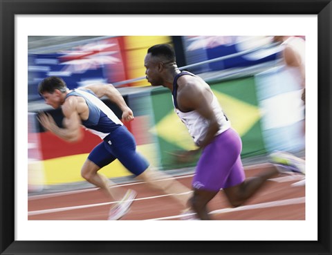 Framed Side profile of two young men running on a running track Print