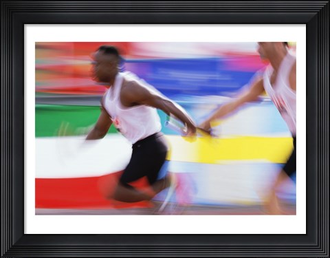 Framed Side profile of two young men passing a relay baton Print