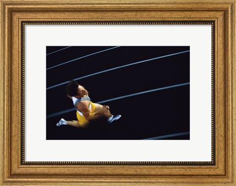 Framed High angle view of a young man running on a running track Print