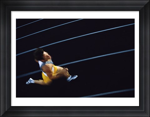 Framed High angle view of a young man running on a running track Print