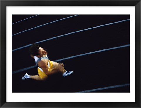 Framed High angle view of a young man running on a running track Print