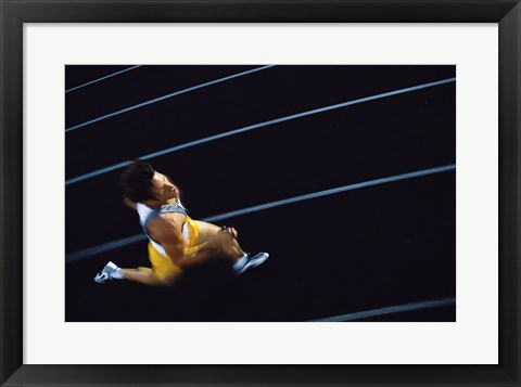 Framed High angle view of a young man running on a running track Print