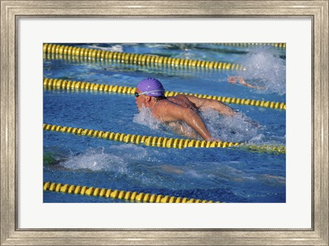 Framed Swimmer racing in a swimming pool Print