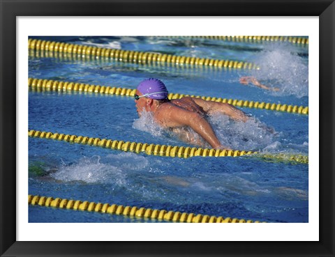 Framed Swimmer racing in a swimming pool Print