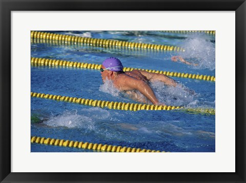 Framed Swimmer racing in a swimming pool Print