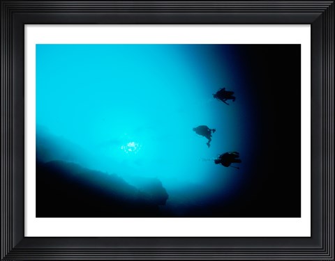 Framed Three scuba divers swimming underwater, Blue Hole, Belize Print