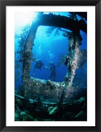 Framed Scuba diver investigating shipwrecks Print