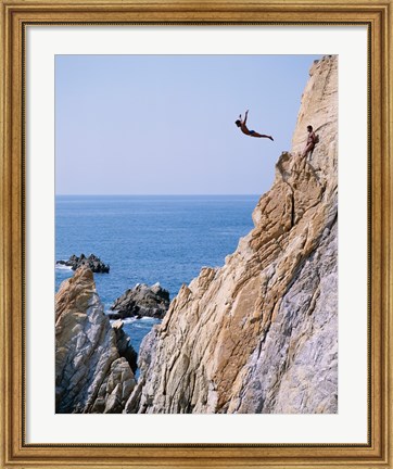 Framed Male cliff diver jumping off a cliff, La Quebrada, Acapulco, Mexico Print