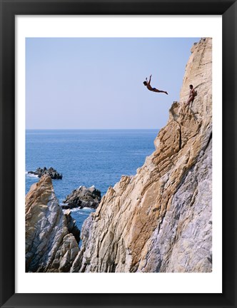 Framed Male cliff diver jumping off a cliff, La Quebrada, Acapulco, Mexico Print