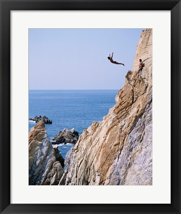 Framed Male cliff diver jumping off a cliff, La Quebrada, Acapulco, Mexico Print