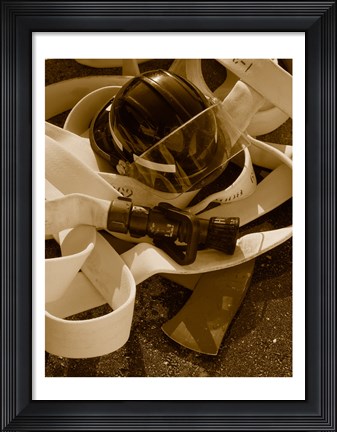 Framed Close-up of a firefighter&#39;s helmet on a fire hose Print