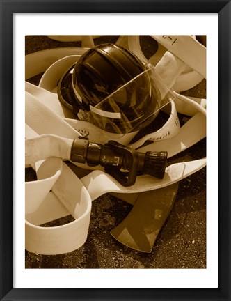 Framed Close-up of a firefighter&#39;s helmet on a fire hose Print