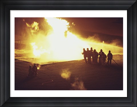 Framed High angle view of firefighters extinguishing a fire Print
