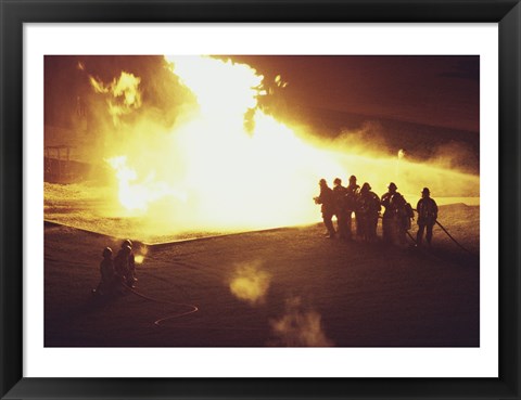 Framed High angle view of firefighters extinguishing a fire Print