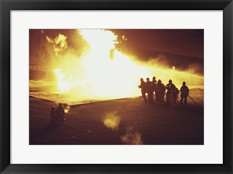 Framed High angle view of firefighters extinguishing a fire Print