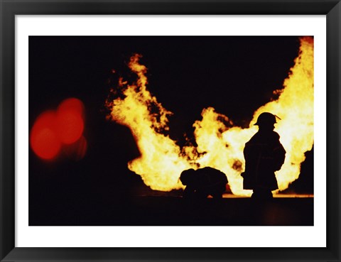 Framed Firefighters In front Of Flames Extinguishing A Fire Print