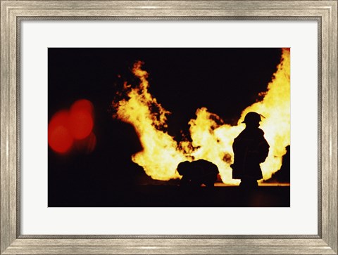 Framed Firefighters In front Of Flames Extinguishing A Fire Print