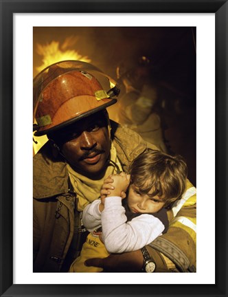 Framed Firefighter carrying a boy Print