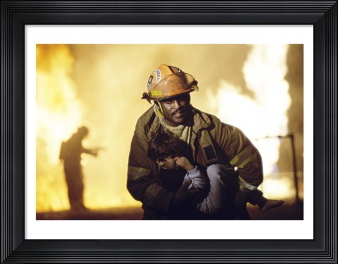 Framed Firefighter carrying a boy Print