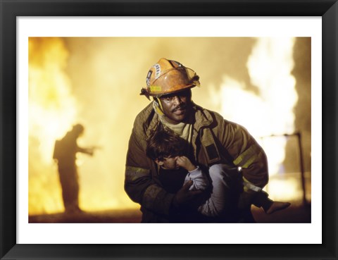 Framed Firefighter carrying a boy Print