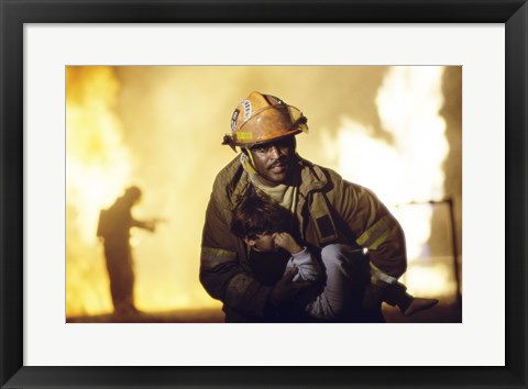 Framed Firefighter carrying a boy Print