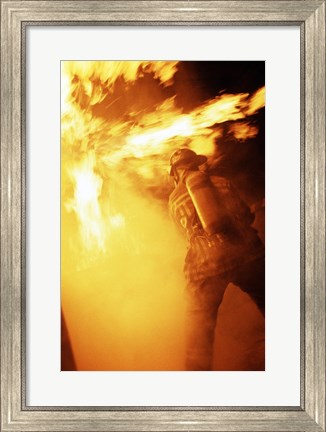 Framed Fireman fighting with fire flames Print