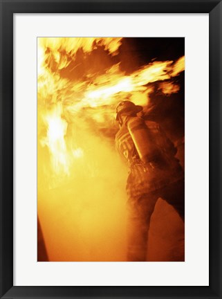 Framed Fireman fighting with fire flames Print