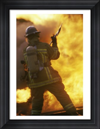 Framed Rear view of a firefighter holding an axe Print