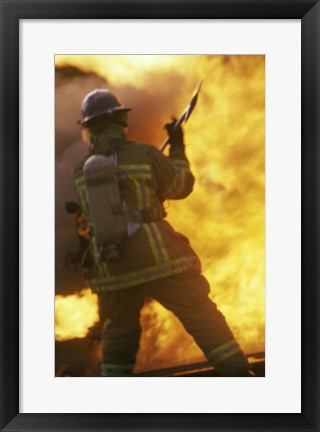 Framed Rear view of a firefighter holding an axe Print