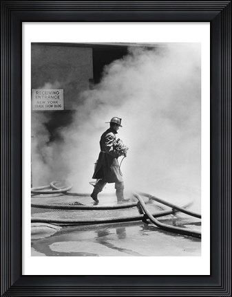 Framed Firefighter walking in front of smoke Print