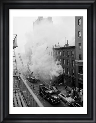 Framed New York City, Fire on East 47th Street, with fire engines shooting water on burning building Print