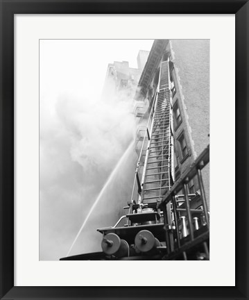 Framed Fire engine with ladder up burning building Print