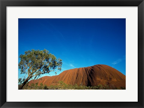 Framed Rock formation on a landscape, Ayers Rock, Uluru-Kata Tjuta National Park, Northern Territory, Australia Print