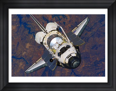 Framed Space Shuttle Discovery approaches the International Space Station Print