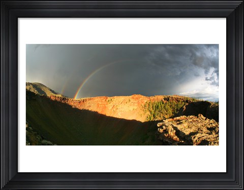 Framed Crater of an extinct volcano with a rainbow in the sky Print