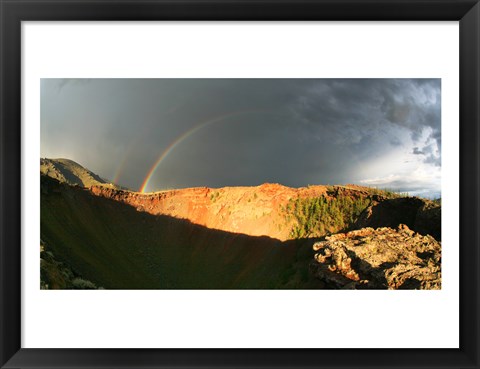 Framed Crater of an extinct volcano with a rainbow in the sky Print