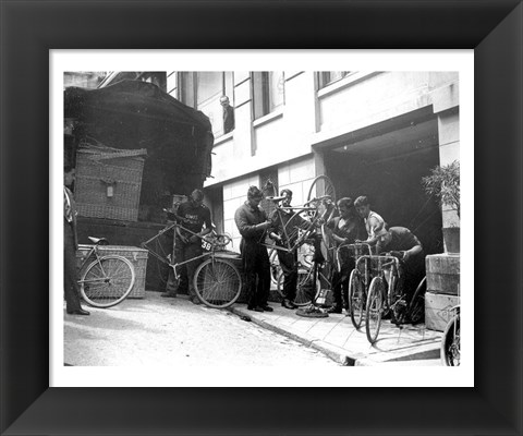 Framed Taking care of  maintenance of the racing bicycles during a rest day in Belfort Print