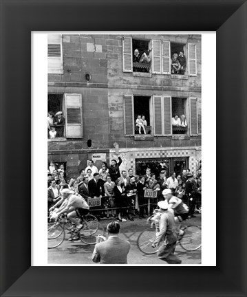 Framed People watching the cyclists being provisioned. Tour de France 1958. Print