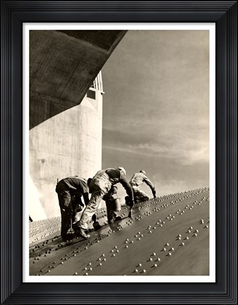 Framed Three construction workers putting a coat of paint on a slanted wall of riveted-steel plates on the Hoover Dam spillway Print