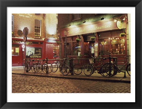 Framed Bicycles parked in front of a restaurant at night, Dublin, Ireland Print